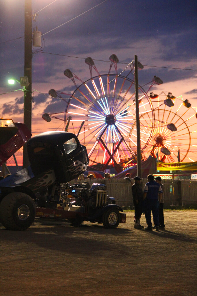 Sunset behind the ferris wheels at the fair
